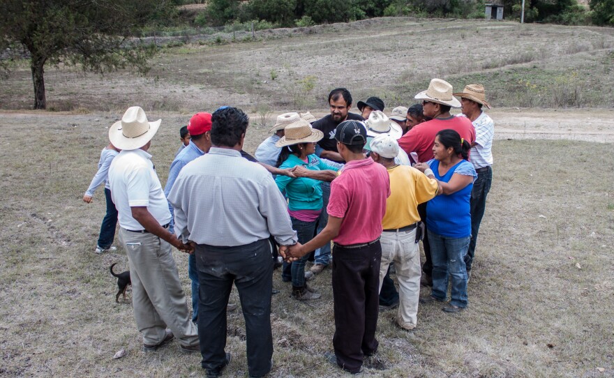 Farmers participate in a trust-building exercise at an organic fertilizer workshop in the Mixteca region of Oaxaca, Mexico. Most of Puente's farmer partners practice what's known as agroecological farming — which prizes maintaining biodiversity — or are "in transition" to these methods.