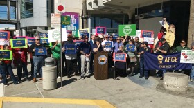 Federal workers and their unions protest the government shutdown outside of the San Diego International Airport, Jan. 25, 2019.