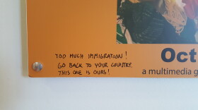 An anti-immigrant message on a poster for an art exhibit on Mexican immigration at the New Americans Museum is shown in this undated photo.
