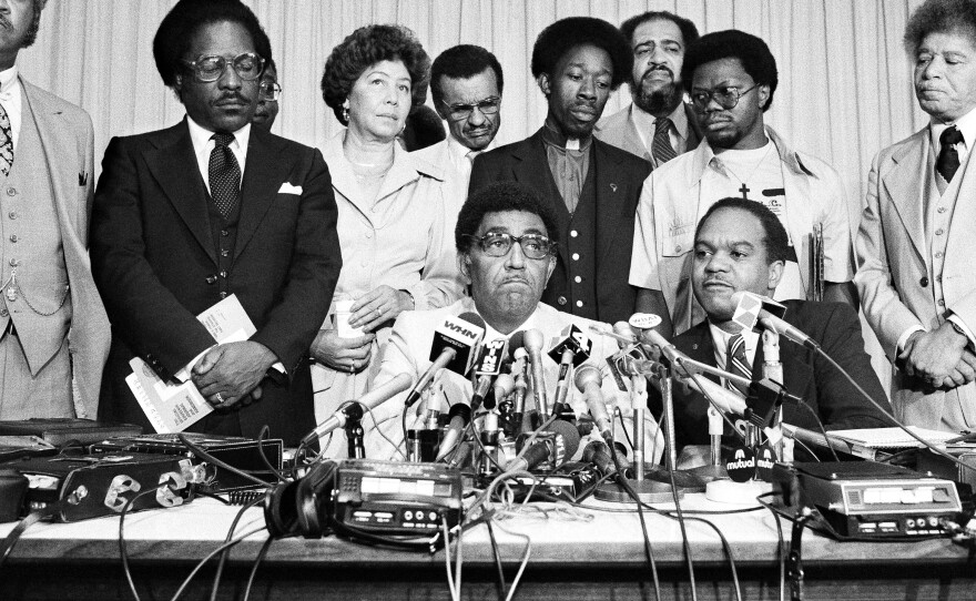 Southern Christian Leadership Conference President Dr. Joseph E. Lowery seated center, at a press conference at the U.N. Church Center in New York, 1979.
