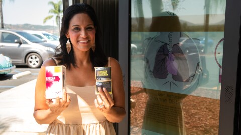 Amy Knox with the Harm Reducation Coalition, stands with Narcan and Fentanyl test strips provided by the first smart-vending machine on tribal lands on August 9, 2024. The machine, placed in a discreet location outside of Casino Pauma, is available to anyone who wants to use it. The machine vends Naloxone, commonly known as Narcan, as well as Fentanyl test strips, free of charge. The machine also provides information for common social services.