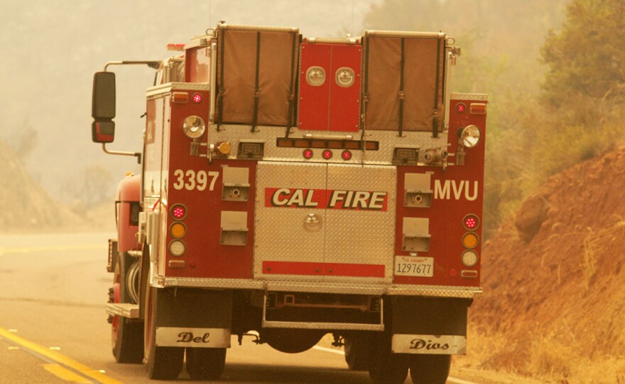 A Cal Fire truck drives drives down a road during the Valley Fire, Sept. 7, 2020.