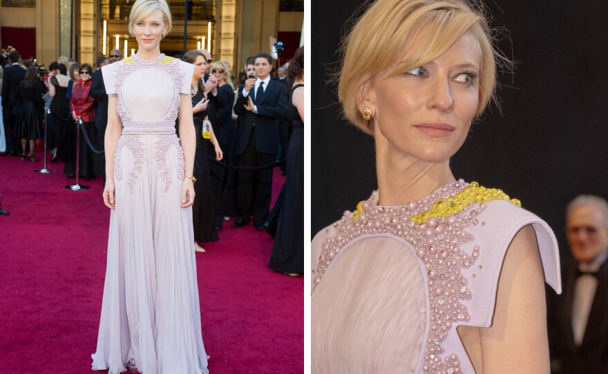 Cate Blanchett in a truly odd gown that had what looked like an empty oval fram on her chest and vomit on her neck.