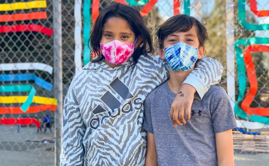 Fourth graders Kenley (left) and Anakin Gupta on the playground of their school, Montclair Elementary School in Oakland, on March 7, 2022.