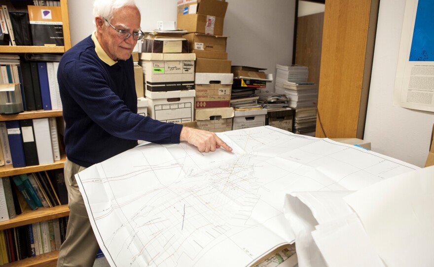 Mark Legg, president of Legg Geophysical, Inc. in Huntington Beach, California, points to various fault lines that have been discovered in and around San Diego.