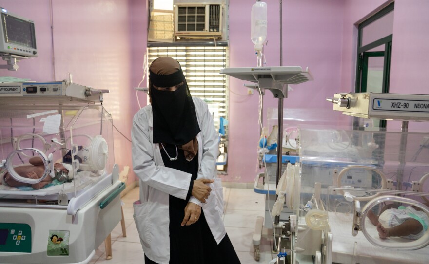 Dr. Manal Abdulhaleem walks through the neonatal intensive care unit at Al-Sadaqa hospital in Aden.