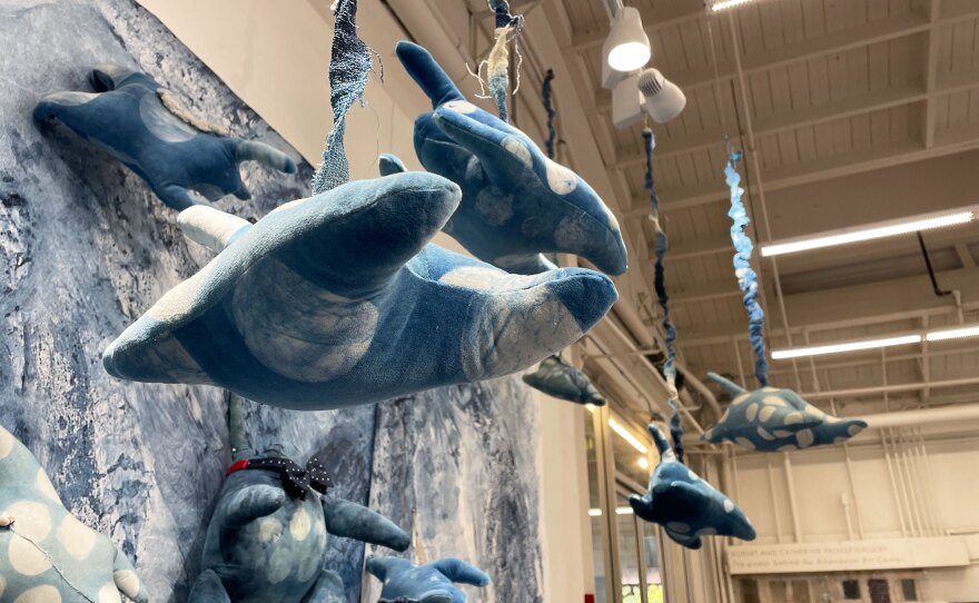Textile works ("munnum" creatures) by artist and printmaker Sibyl Rubottom hang from the ceiling at the Athenaeum Art Center on Dec. 19, 2022, part of Rubottom's "Visual Memoir: 1962-2022" exhibition.