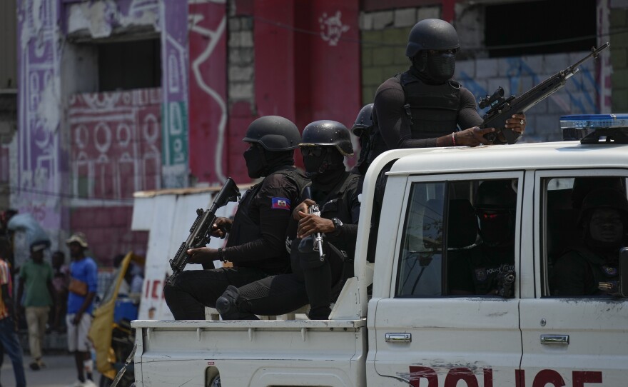 Police patrol the Champ de Mars area of Port-au-Prince, Haiti, April 24.
