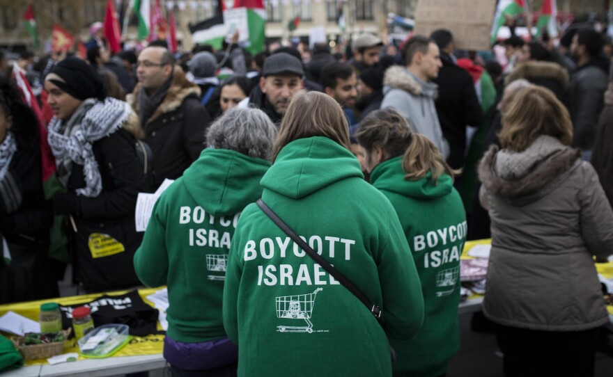 Demonstrators advocating the movement to boycott, divest from and sanction Israel, known as BDS, gather for a protest last year in Paris. On Thursday, U.S. Secretary of State Mike Pompeo announced a new policy specifically countering the global BDS campaign.