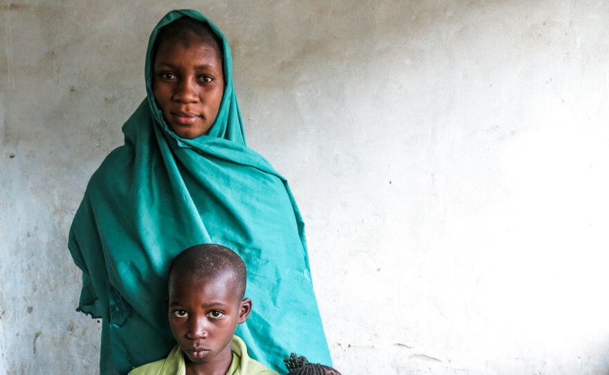 Aissatou Sanogo with two of her three children, Issa, 7, and Binetou, 3. Her 2-year-old was asleep when the picture was taken. Their father drowned in the Mediterranean while trying to reach Europe, hoping to earn a good living there to support his family in Senegal.