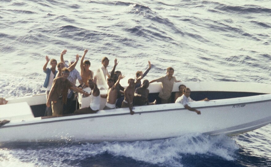 Refugees aboard a vessel in the small port of Mariel, Cuba, on April 23, 1980, wait to sail to the U.S. Fidel Castro agreed to let them leave the island for Florida in what became known as the Mariel boatlift. More than 100,000 Cubans made it to the U.S. The new arrivals included many thousands released from Cuba's prisons and mental institutions, leading to a tightening of the U.S. embargo.