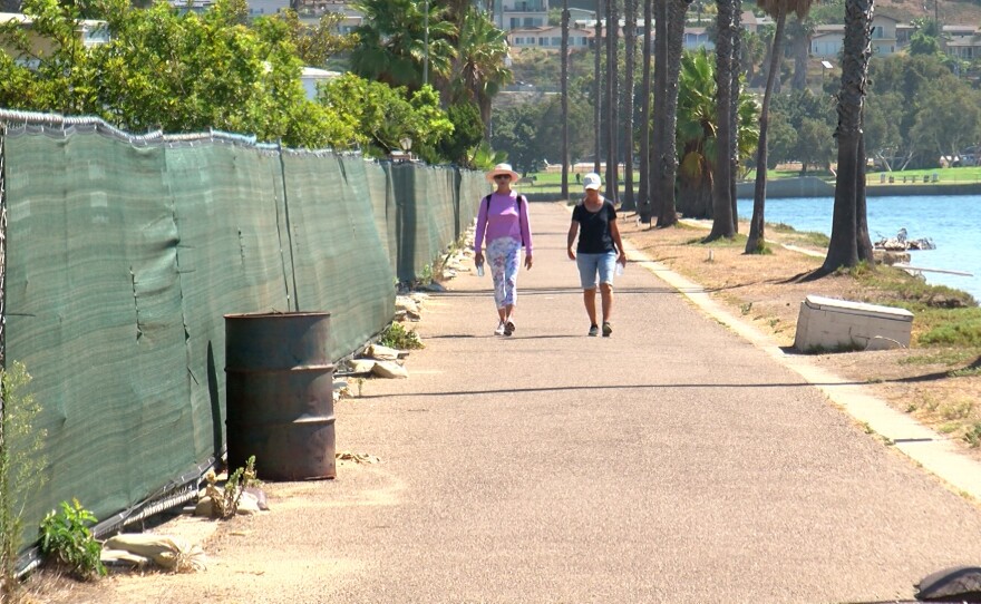 Pedestrians are shown walking on the path that surrounds the old DeAnza Point Mobile Home Park on August 31, 2022.