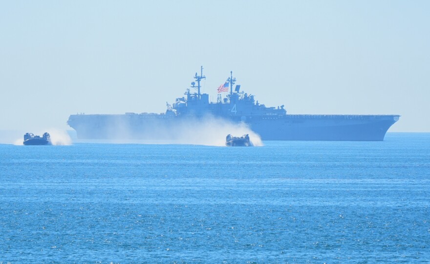 Marines perform in a demonstration with hovercraft and the amphibious assault ship USS Boxer during activities to mark the Marine Corps' 250th anniversary, Oct 18, 2025, on Marine Corps Base Camp Pendleton in Camp Pendleton, Calif.