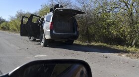 A damaged pick up marked with the initials C.D.N., that in Spanish stand for Cartel of the Northeast, is abandoned on the side of a near Villa Union, Mexico, Sunday, Dec. 1, 2019, the day after it was assaulted by gunmen.