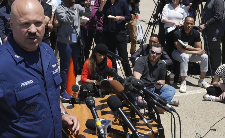 U.S. Coast Guard Capt. Jamie Frederick faces reporters Wednesday during a news conference at Coast Guard Base Boston.