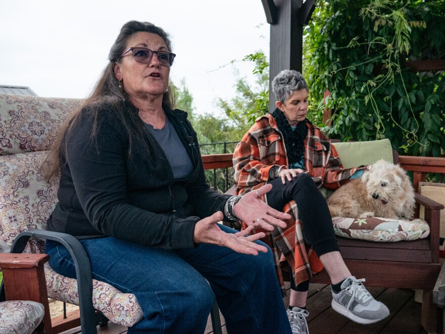 Carlsbad resident Jeanne Mille (left) shares stories about a dog named Franklin in this photo taken June 4, 2025. Miller adopted Franklin in December 2024 from a San Diego County animal shelter, but she ultimately had to return him.