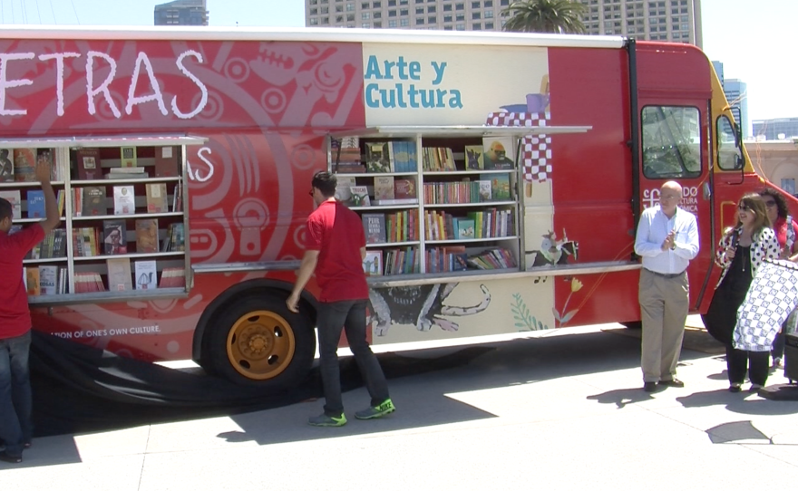 Fondo de Cultura Económica employees unveil a new Spanish-language book truck in San Diego, Aug. 29, 2015.