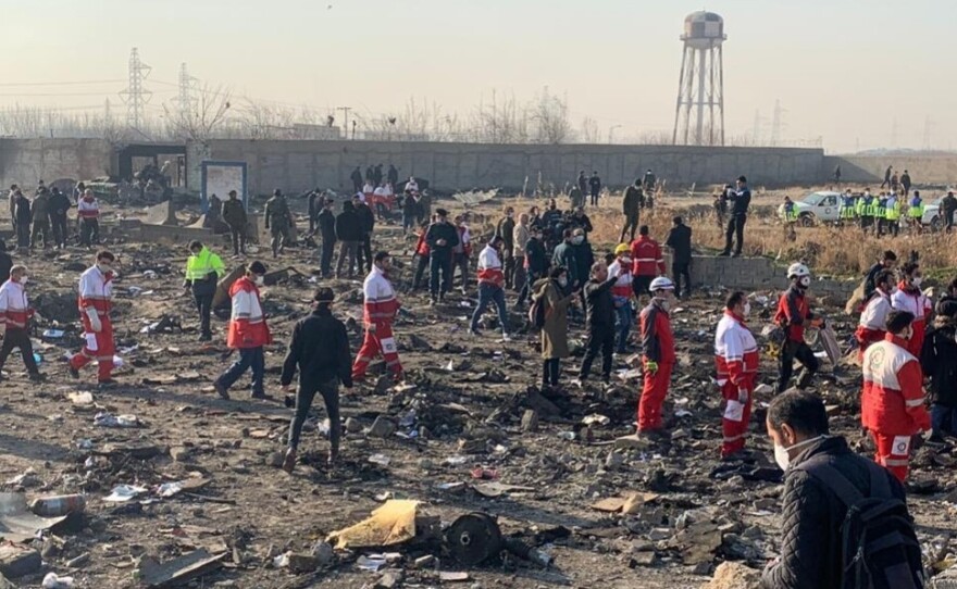 Search and rescue workers at the crash site of a Ukrainian Boeing 737 outside Tehran, Iran. The plane crashed just after takeoff, killing all 176 aboard.