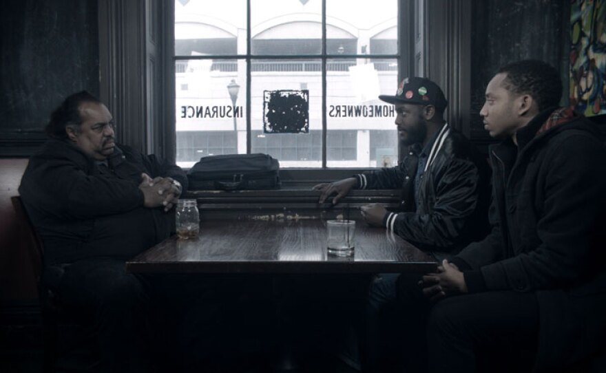 Daryl Davis and social activists Tariq Touré (left) and Kwame Rose (right) share their views in Baltimore, Md.