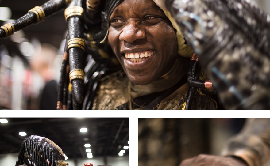 Jayson Brown of Sterling, Va., portrays Predator from the 1987 film. Brown has spent the past two years working on his costume, which includes a Predator ring that he wears even when he's not cosplaying. Brown's daughter Skyla Brown is dressed as the Queen of Hearts from Alice in Wonderland.