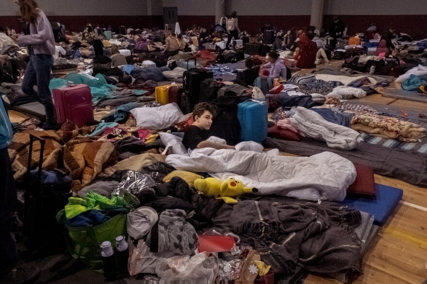 Hundreds of Ukrainian war refugees are living in the Tijuana's Recreation Center called the "Unidad Deportiva Benito Juárez", sleeping mats have be place on the basket ball court, one next to the other, making beds for up to 600 Ukrainians fleeing the war, Tijuana, April 4, 2022.<br/>