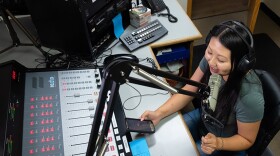 Vila Xiong operates the mixing board herself while hosting the "Generation X" show on KBIF in this undated photo. 