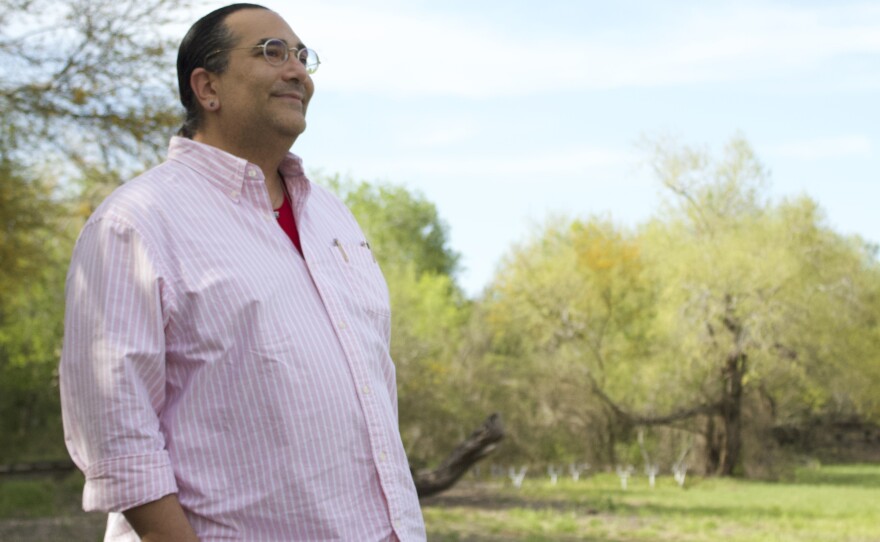 Christopher Basaldú, PhD, stands at Resaca De Las Palmas State Park in Brownsville. Basaldú was forced to find new housing when rents started raising across the city.