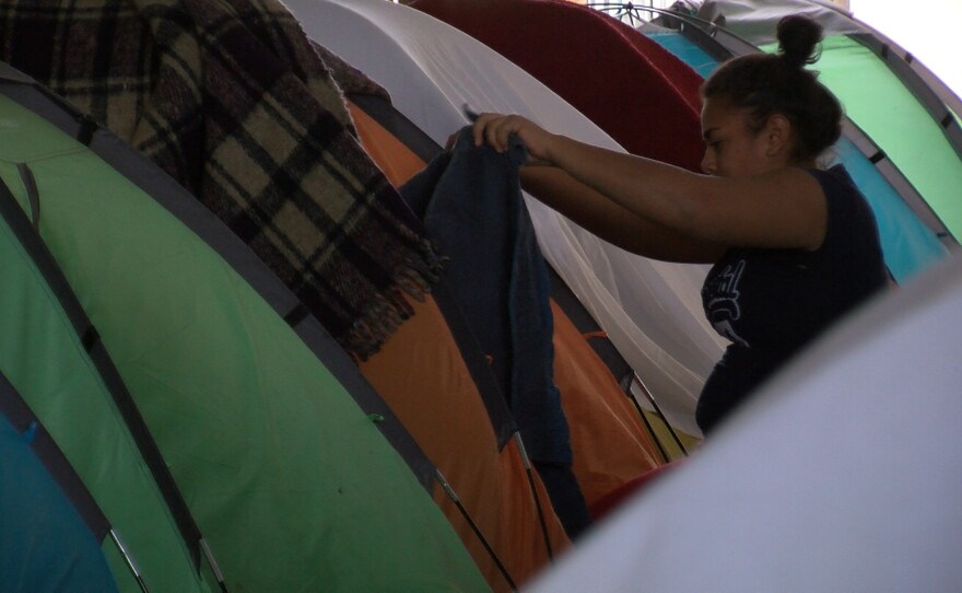 Asylum-seekers rest in tents in Tijuana, April 24, 2018.