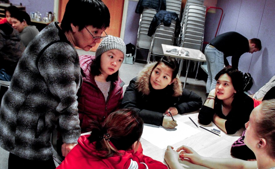 Guidance counselor Alice Pivat talks to 15-year-old girls during a suicide prevention class in Tasiilaq.