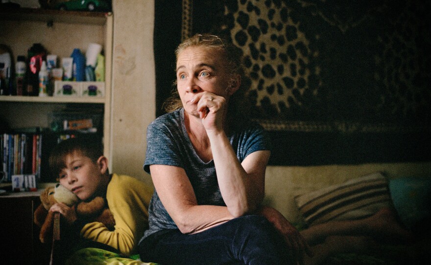 Svitlana and her son Danil in a dormitory room in Sloviansk, Donetsk region, where they lived before evacuating from Donbas. June 2022.