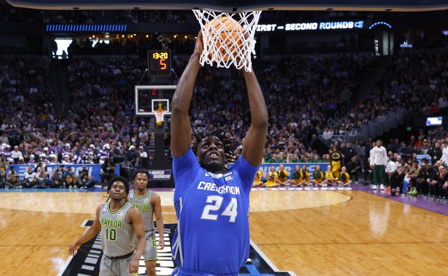 Arthur Kaluma #24 of the Creighton Bluejays dunks during the second half against the Baylor Bears at Ball Arena on Sunday in Denver.