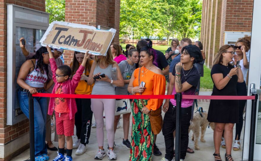 Fans of Johnny Depp gather outside the Fairfax County Circuit Courthouse in Fairfax, Va., on Wednesday.