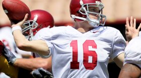 Quarterback Mitch Mustain throws a pass during a USC Trojans spring game. USC is part of the Pac-10, which has always been celebrated as a virtual seminary in the pigskin marketplace. The Pac-10 recently hired a promoter from international tennis to be its commissioner.