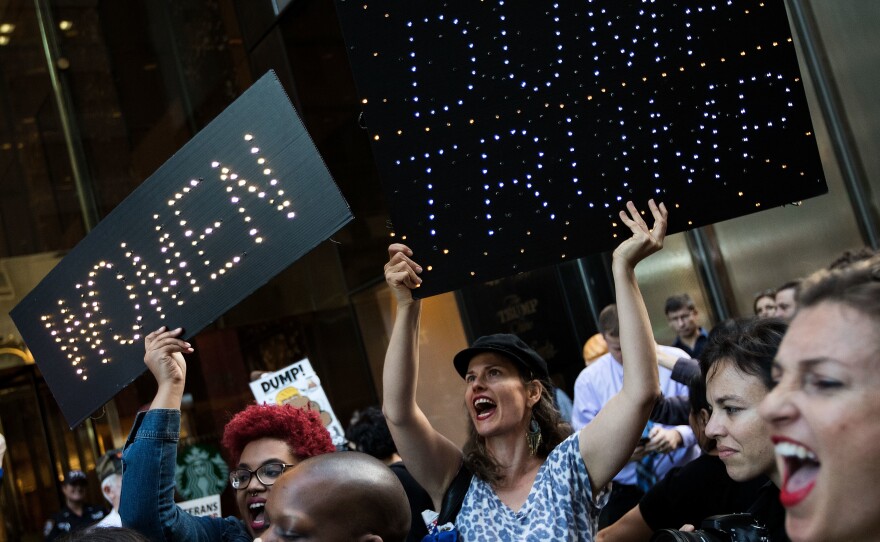A group of protesters, made up mostly of women, rally against then-Republican presidential candidate Donald Trump outside of Trump Tower in New York City on Nov. 3, 2016.