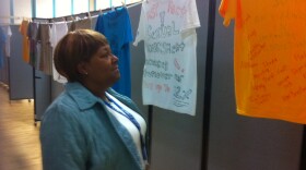 Aundrea Harney reads a T-shirt in the Clothesline Project at the San Diego Veteran's Affairs Medical Center, on April 26, 2011 in San Diego, Calif.