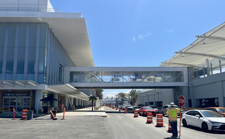 Cars drive by the outside of San Diego International Airport's new Terminal 1 building, Aug. 27, 2025.