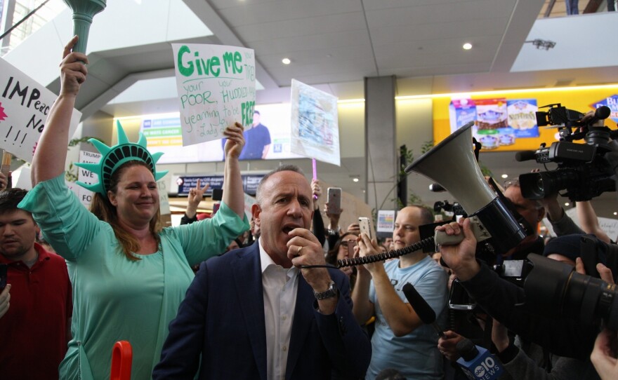 Sacramento Mayor Darrell Steinberg addresses protesters in Terminal B of the Sacramento International Airport in California.