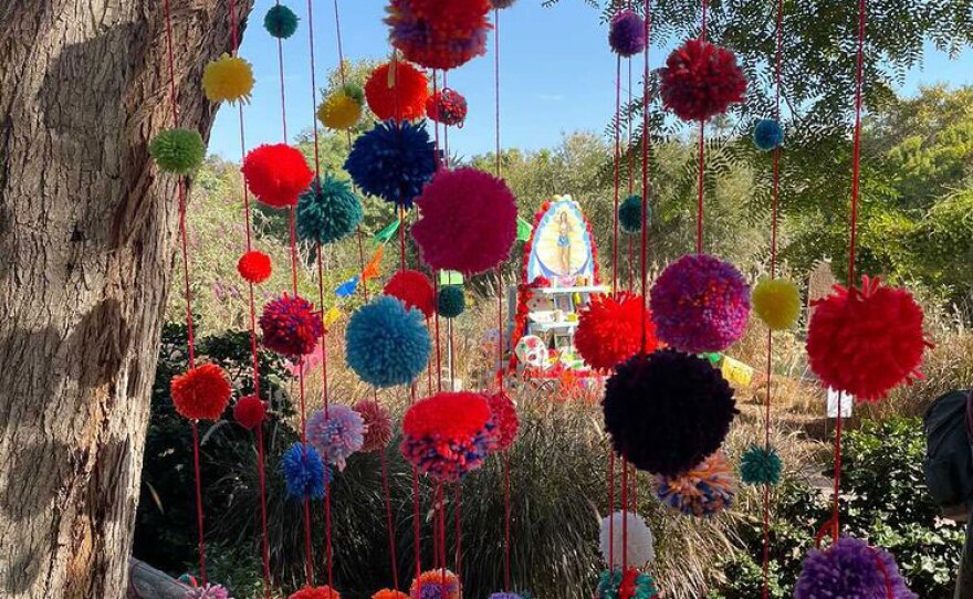 Katie Ruiz's pom poms installed at San Diego Botanic Garden.