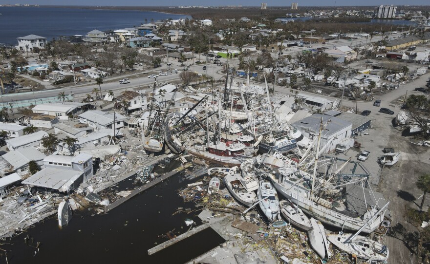 In this photo shot with a drone, shrimp boats lie grounded atop what was a mobile home park following the passage of Hurricane Ian on San Carlos Island in Fort Myers Beach, Fla., on Oct. 7.