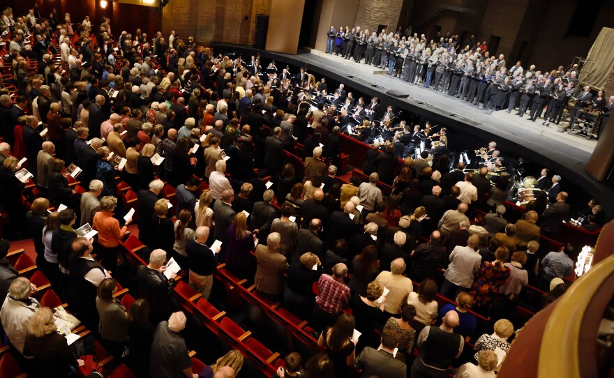 The Metropolitan Opera and Orchestra performs the French National Anthem during the matinee performance of Puccini's <em>Tosca</em>, in New York.