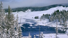Winter in Yellowstone, Wyo. You can see some steam near the river resulting from geothermal activity.