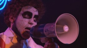 Adam Traub of The Burning of Rome shouts into a megaphone.