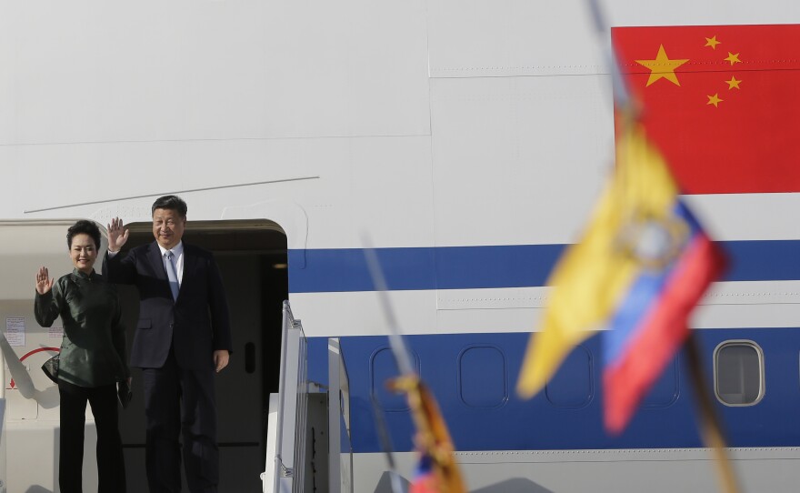 Chinese President Xi Jinping and his wife Peng Liyuan wave goodbye as they depart Quito, Ecuador, following a trip in 2016.