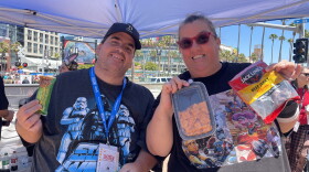 Local Comic-Con attendees Alex Tuttle and Jason Houck pose with their survival snacks. “Cheeze-Its and beef jerky,” Tuttle said. The classics.
