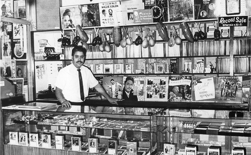 Mike Amadeo in his Bronx record shop, 1960s.