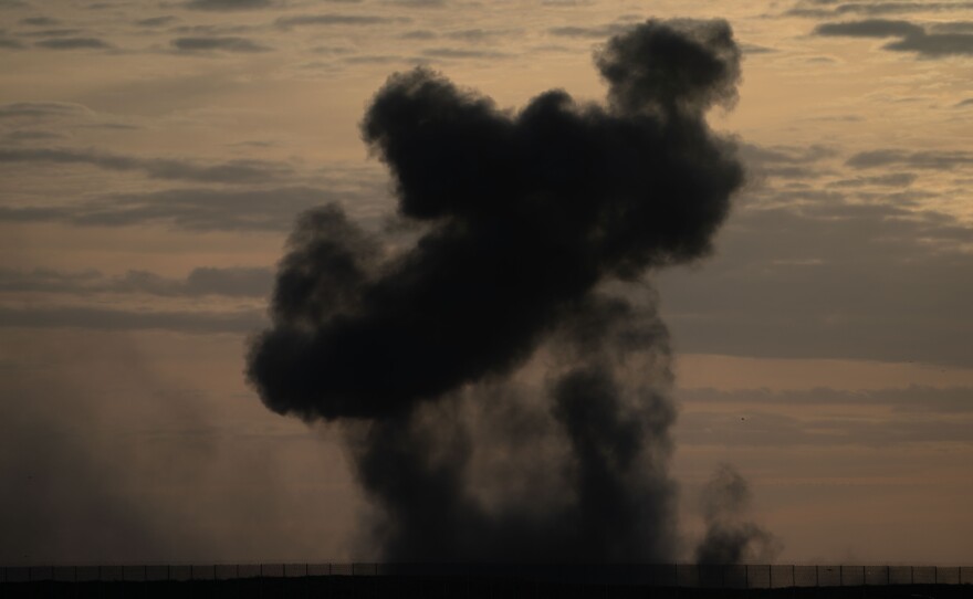 Smoke rises from an airstrike in Gaza, as seen from Israel's southern border with the Gaza Strip, on Thursday.