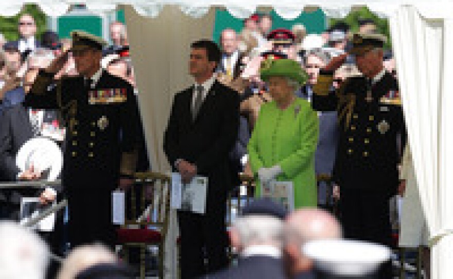 Prince Philip, Duke of Edinburgh (from left), French Prime Minister Manuel Valls, Queen Elizabeth II and Prince Charles, Prince of Wales, attend a service at Bayeux Cemetery during a commemoration Friday in Bayeux, France.
