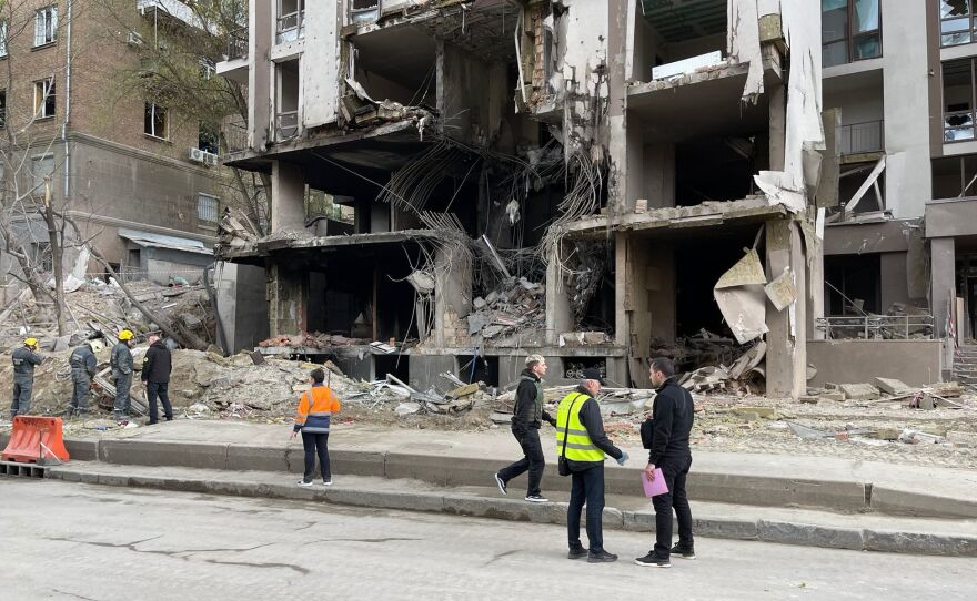 An apartment building in Kyiv was hit by a Russian attack on Thursday, killing a journalist who lives there. It's next to a factory that makes missile parts — but also vacuum cleaners.