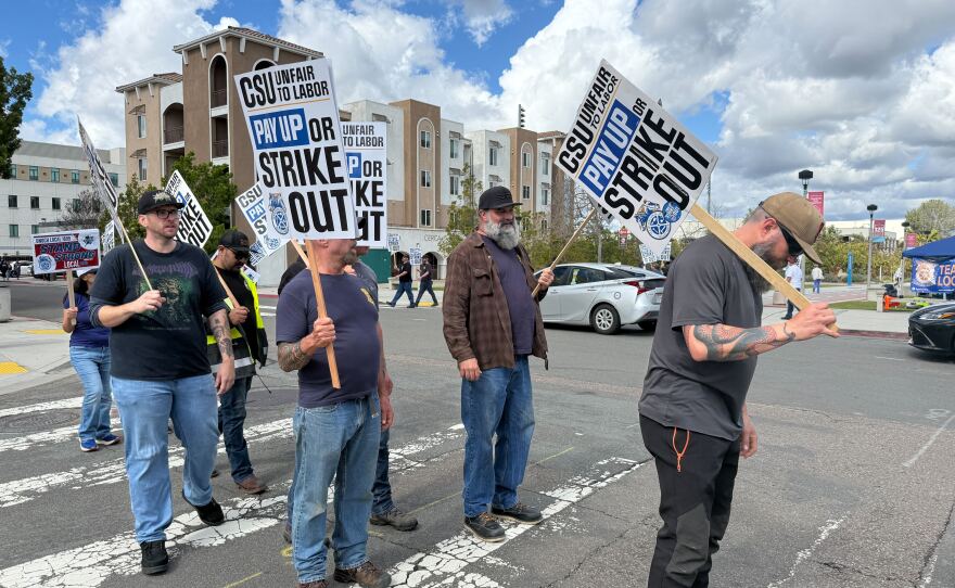 Members of Teamsters Local 2010 are shown walking a picket line at San Diego State University on February 17, 2026.