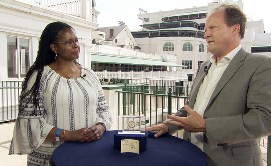 Ian Ehling (right) appraises a 1964 Robert F. Kennedy-inscribed card with box at Churchill Downs Racetrack in Louisville, Ky.
